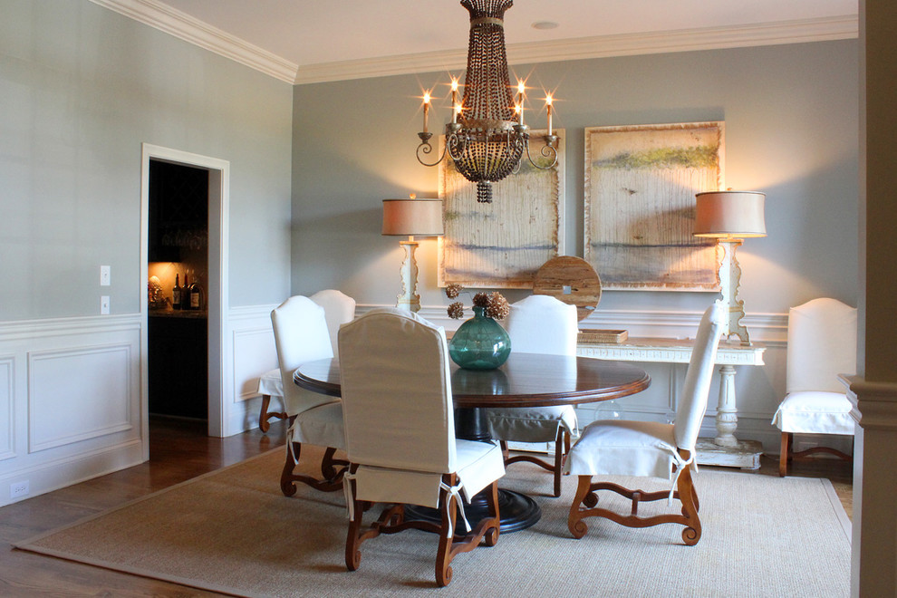 Design ideas for a traditional dining room in Other with grey walls and dark hardwood floors.