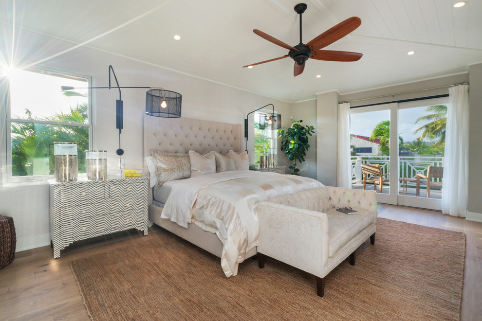 Design ideas for a mid-sized transitional master bedroom in Orange County with grey walls, medium hardwood floors and brown floor.