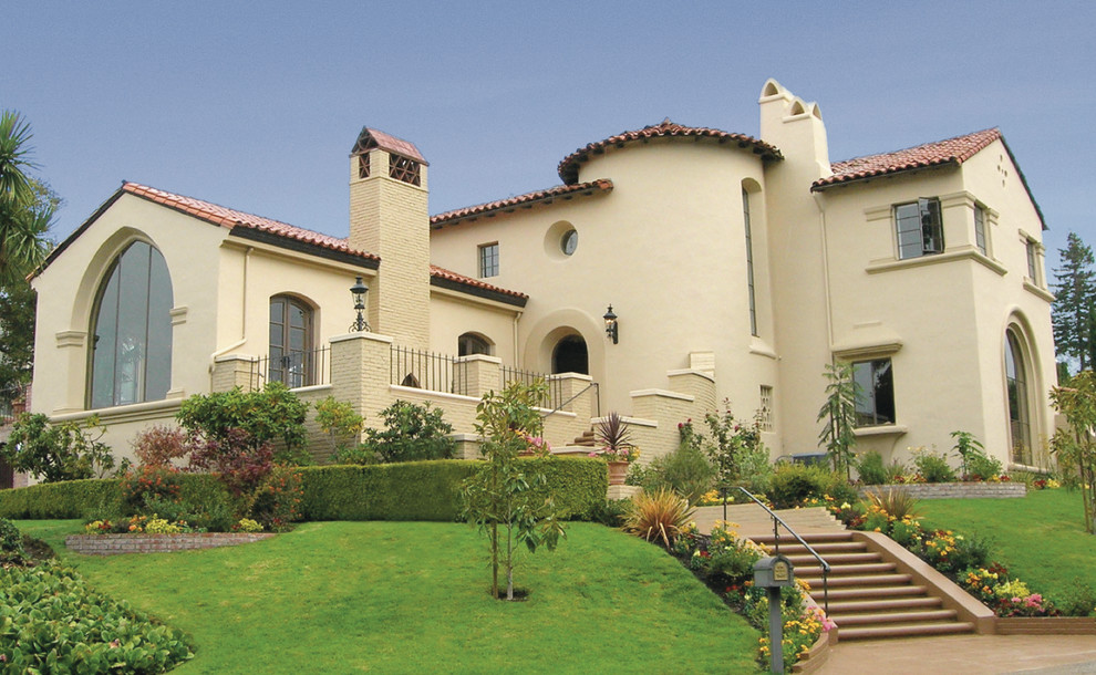Photo of a large mediterranean two-storey stucco beige exterior in San Francisco.
