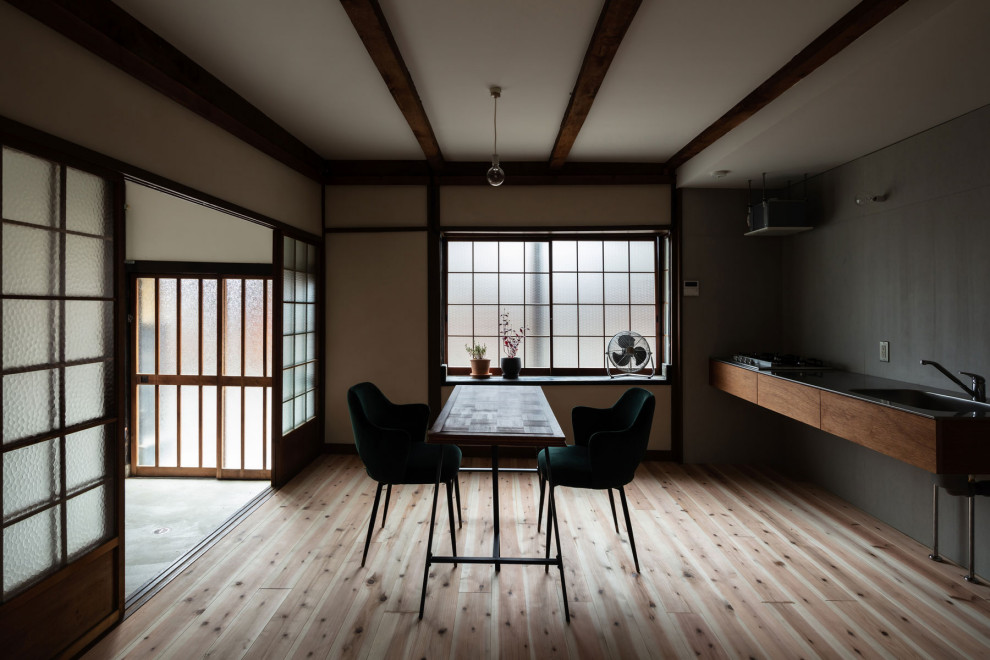Photo of a small traditional open plan dining in Kyoto with white walls, light hardwood floors, beige floor, exposed beam and planked wall panelling.