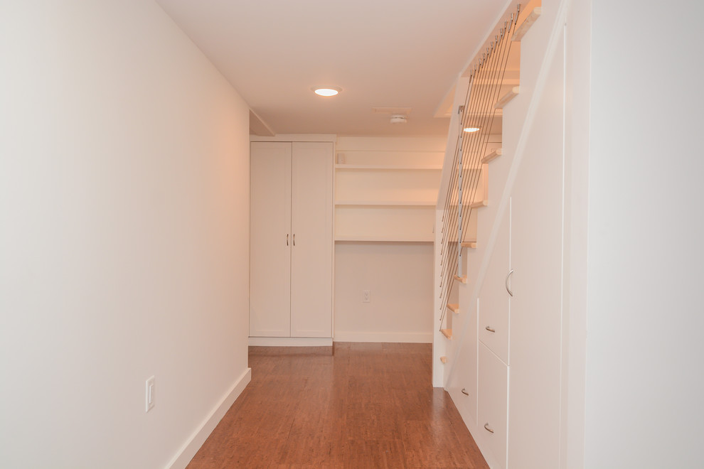 Inspiration for a mid-sized transitional wooden straight cable railing staircase remodel in Boston with painted risers