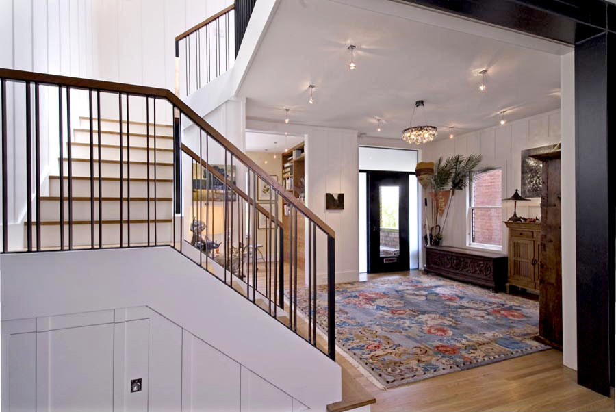 Design ideas for a large contemporary wood u-shaped staircase in San Francisco with painted wood risers and mixed railing.