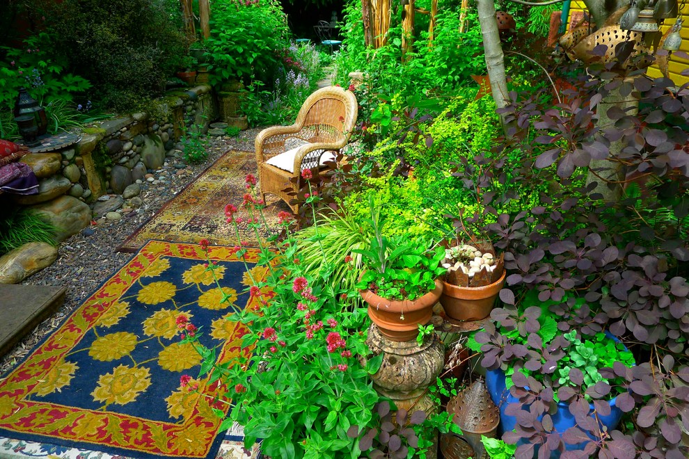 Inspiration for an eclectic patio in Portland with gravel and no cover.