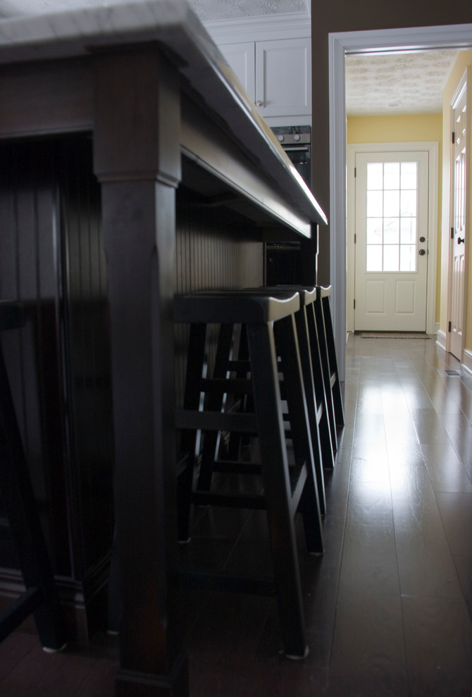 Inspiration for a transitional dark wood floor kitchen remodel with dark wood cabinets
