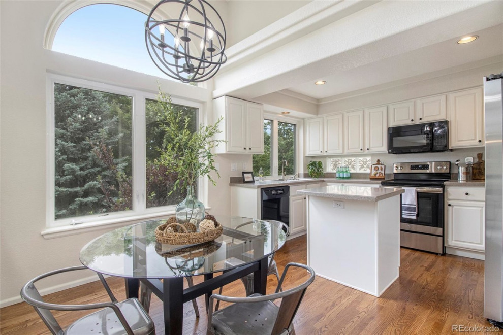 Example of a transitional kitchen design in Denver