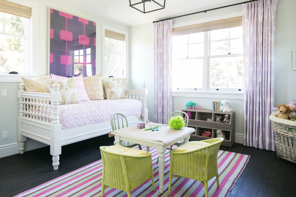 This is an example of a transitional kids' room for girls in Los Angeles with grey walls, dark hardwood floors and black floor.