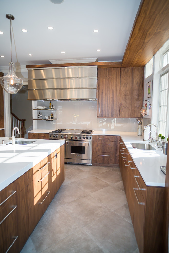 Example of a large transitional l-shaped beige floor eat-in kitchen design in DC Metro with an undermount sink, flat-panel cabinets, medium tone wood cabinets, white backsplash, stainless steel appliances and an island