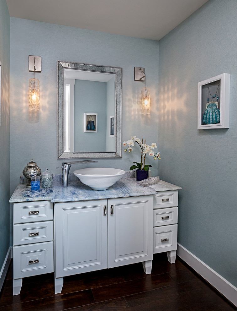 Photo of a mid-sized contemporary powder room in Detroit with white cabinets, marble benchtops, blue walls, dark hardwood floors, raised-panel cabinets and blue benchtops.