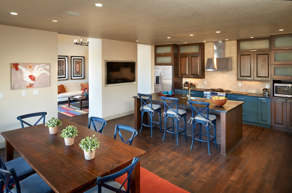 Contemporary galley eat-in kitchen in Denver with raised-panel cabinets, blue cabinets, beige splashback and stainless steel appliances.