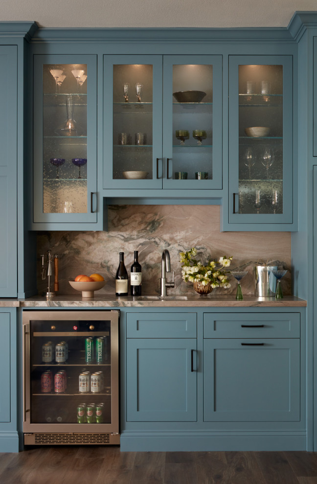 This is an example of a transitional single-wall wet bar in San Francisco with an undermount sink, shaker cabinets, blue cabinets, brown splashback, stone slab splashback, dark hardwood floors, brown floor and brown benchtop.