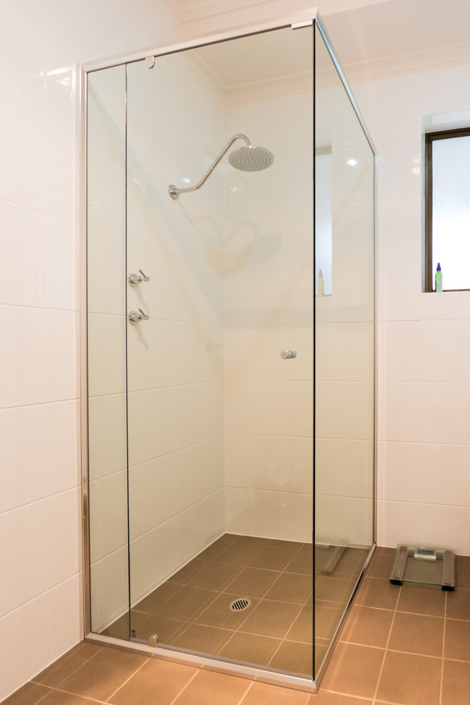 Inspiration for a contemporary bathroom in Adelaide with a corner shower.