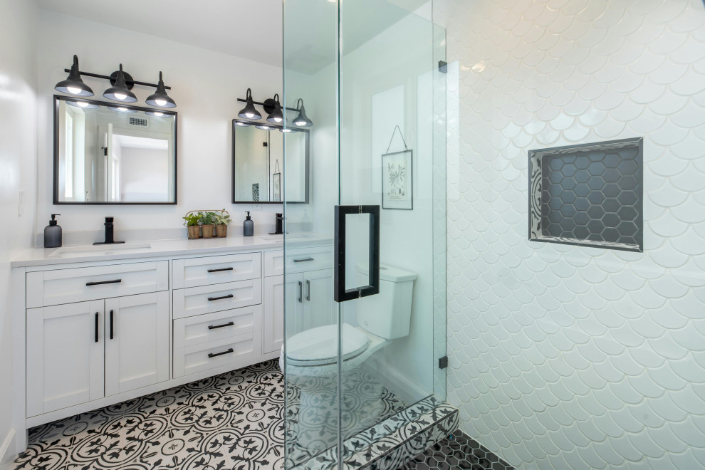 basement bathroom with double sink and walk in shower