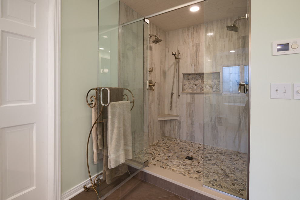 This is an example of a large eclectic master bathroom in Indianapolis with recessed-panel cabinets, white cabinets, a freestanding tub, beige tile, ceramic tile, beige walls, ceramic floors, an undermount sink and engineered quartz benchtops.