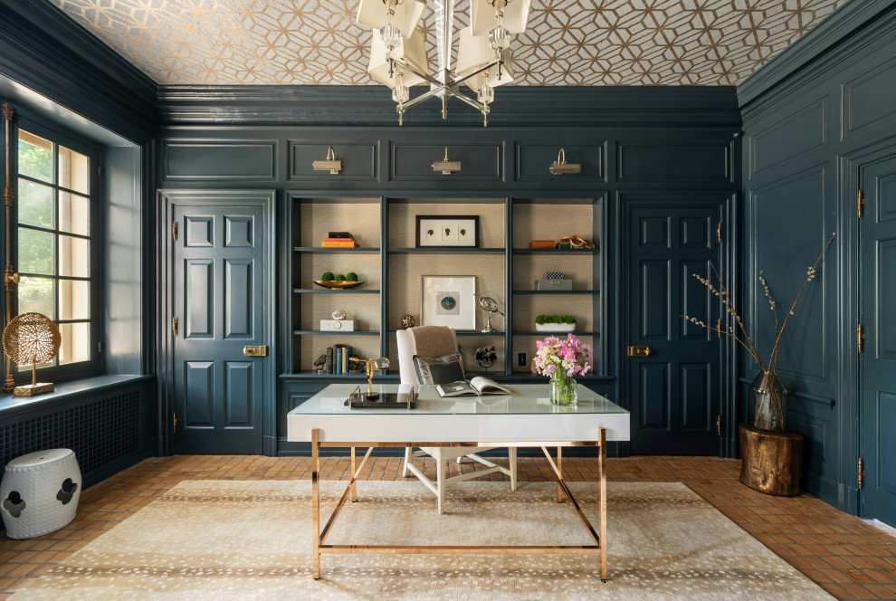 This is an example of a traditional home office in Philadelphia with blue walls, a freestanding desk, orange floor, wallpaper and panelled walls.