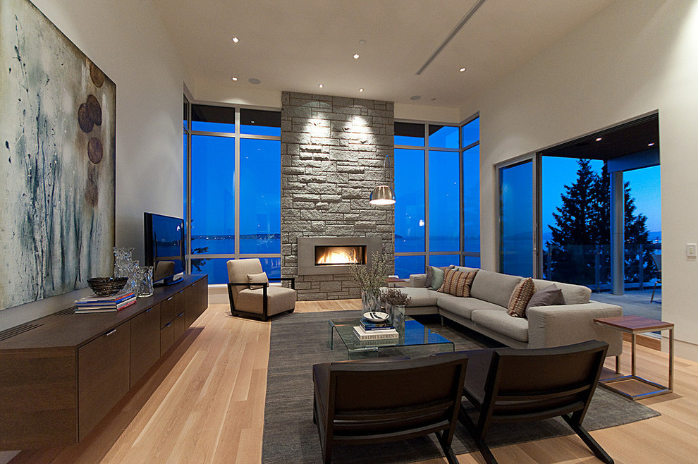 Design ideas for a contemporary formal living room in Vancouver with a ribbon fireplace and a stone fireplace surround.