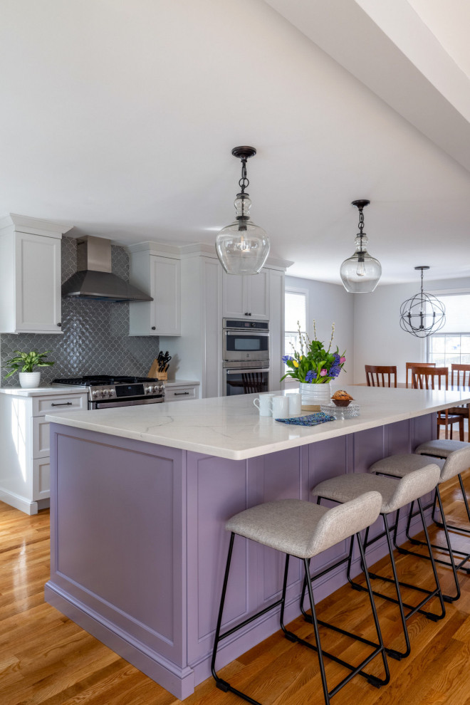 Transitional l-shaped light wood floor kitchen photo in Boston with a farmhouse sink, shaker cabinets, purple cabinets, quartz countertops, gray backsplash, ceramic backsplash, stainless steel appliances, an island and white countertops