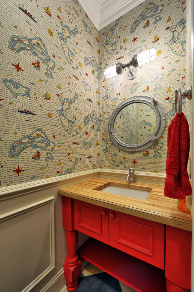 Beach style powder room in Philadelphia with wood benchtops, red cabinets and brown benchtops.
