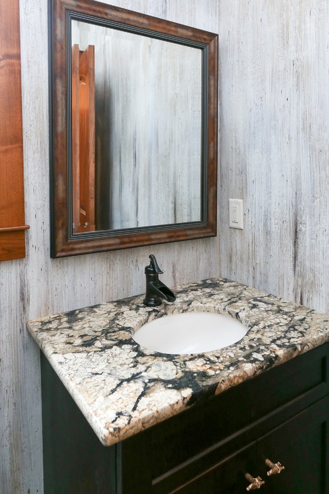 Design ideas for a mid-sized country powder room in Other with black cabinets, gray tile, grey walls, an undermount sink, granite benchtops and multi-coloured benchtops.