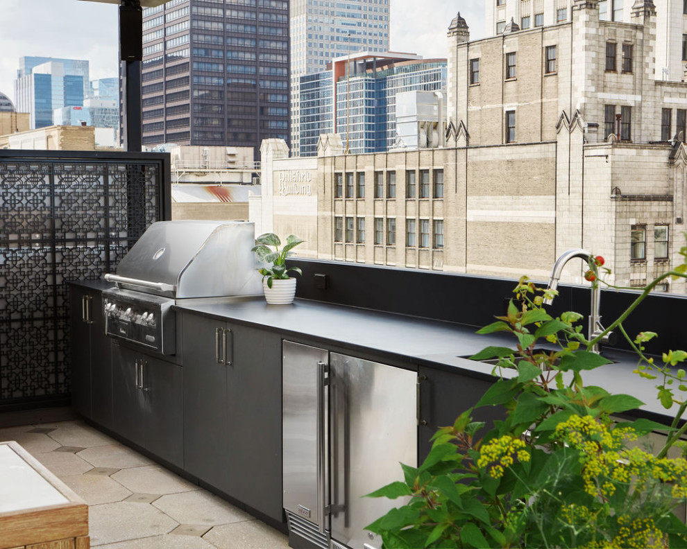 Inspiration for a large modern rooftop and rooftop deck in Chicago with an outdoor kitchen, a pergola and metal railing.
