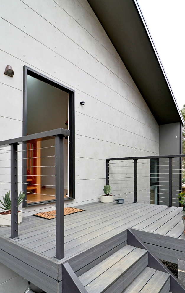 Inspiration for a contemporary courtyard deck in Hobart with no cover and mixed railing.