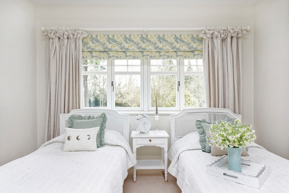 Traditional guest bedroom in Surrey with grey walls, carpet and beige floor.
