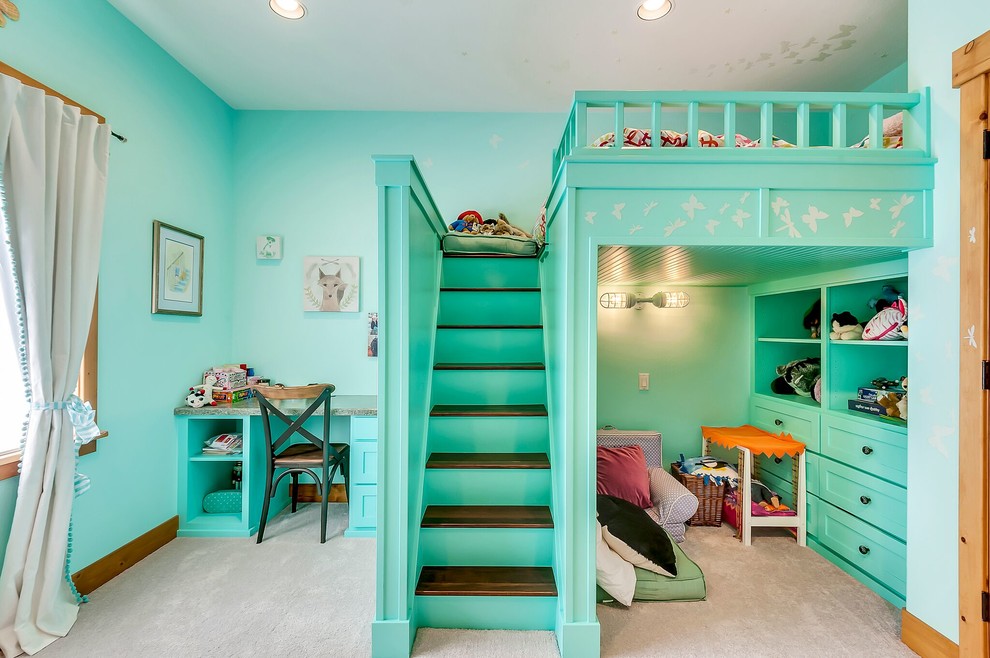 This is an example of a mid-sized traditional kids' bedroom for girls and kids 4-10 years old in Other with blue walls, carpet and beige floor.
