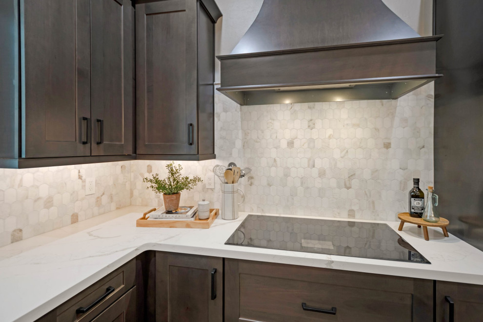 Inspiration for a large porcelain tile and brown floor eat-in kitchen remodel in Phoenix with an undermount sink, shaker cabinets, quartz countertops, multicolored backsplash, marble backsplash, stainless steel appliances, an island and white countertops