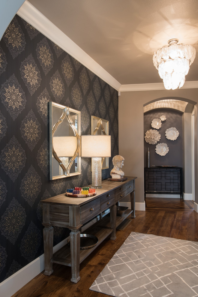 Inspiration for a mid-sized transitional medium tone wood floor hallway remodel with gray walls