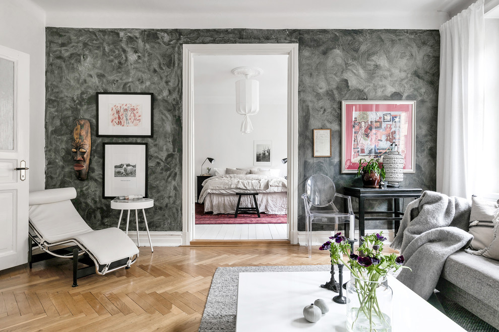 Photo of a mid-sized scandinavian formal enclosed living room in Gothenburg with grey walls, light hardwood floors and beige floor.