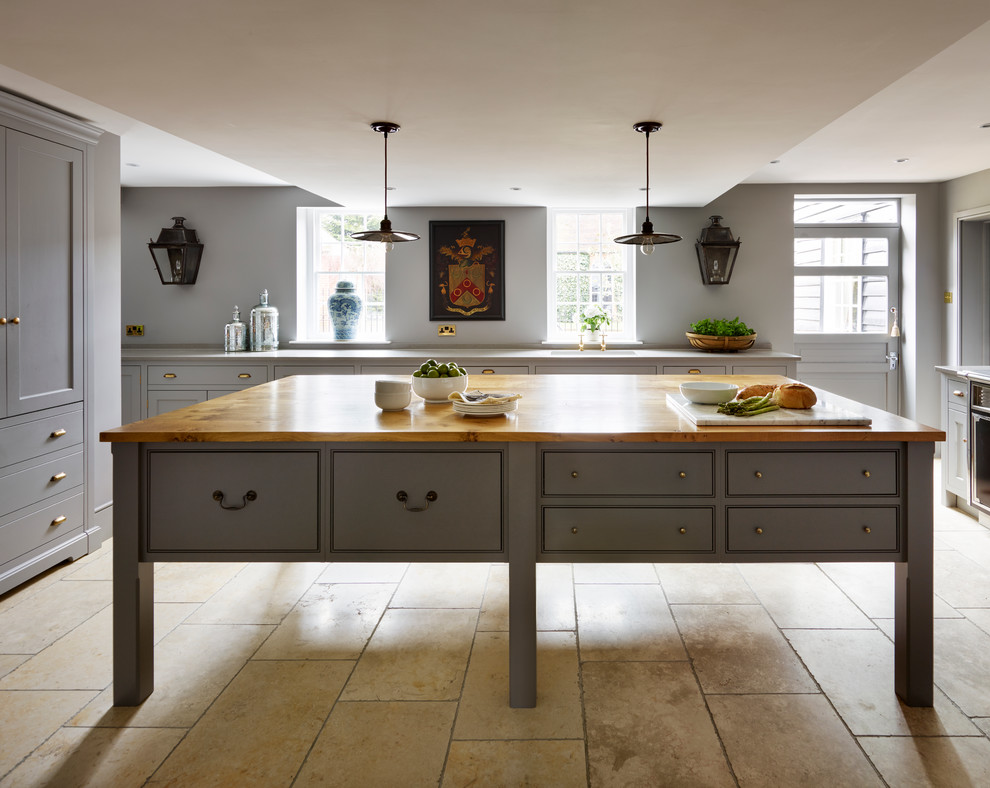 Inspiration for a large transitional open plan kitchen in Essex with recessed-panel cabinets, grey cabinets, panelled appliances and with island.