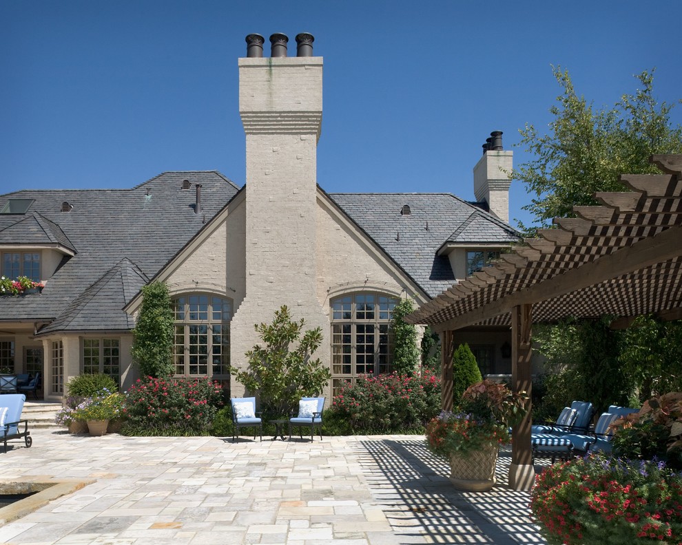 This is an example of a mediterranean beige exterior in Wichita.