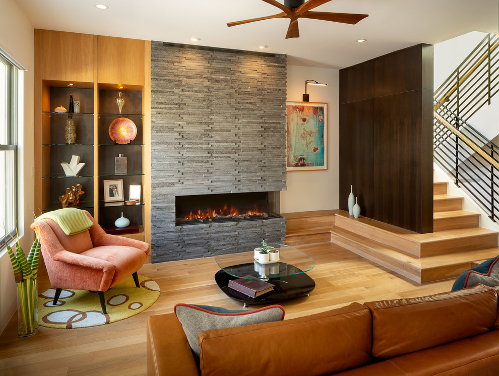 Photo of a mid-sized midcentury formal open concept living room in San Francisco with white walls, a stone fireplace surround, light hardwood floors, a ribbon fireplace and no tv.