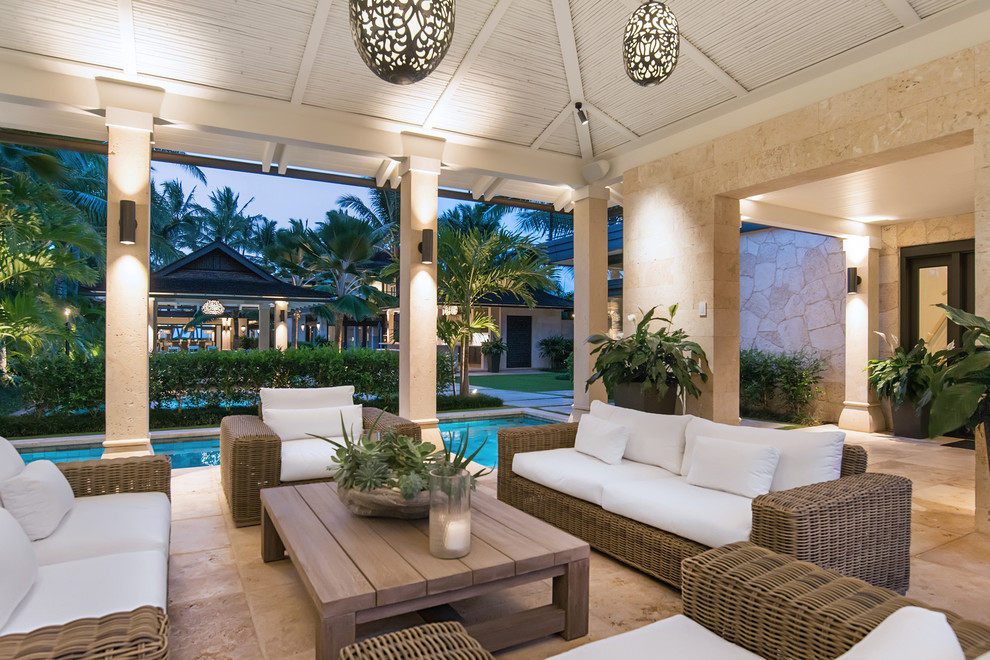 This is an example of a mid-sized beach style side yard patio in Hawaii with tile.