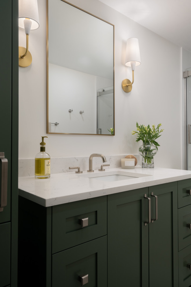 Photo of a small modern kids bathroom in Montreal with shaker cabinets, green cabinets, an alcove tub, an alcove shower, a one-piece toilet, white tile, ceramic tile, white walls, mosaic tile floors, an undermount sink, engineered quartz benchtops, beige floor, a sliding shower screen, white benchtops, a single vanity and a freestanding vanity.