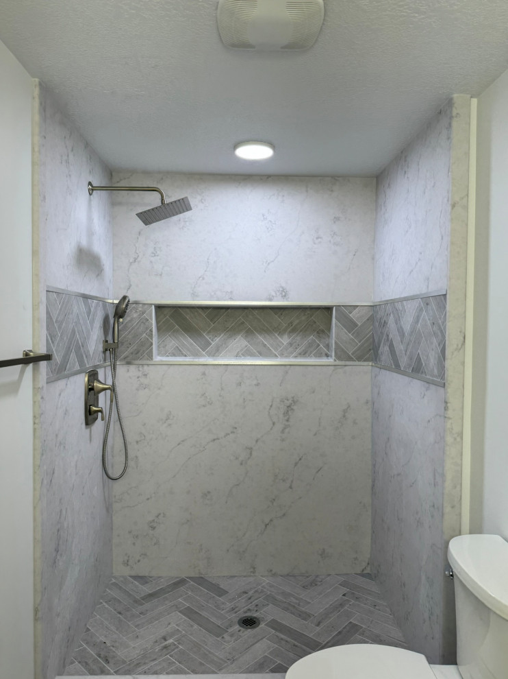 Basement bathroom solid surface shower before sliding shower glass installation.