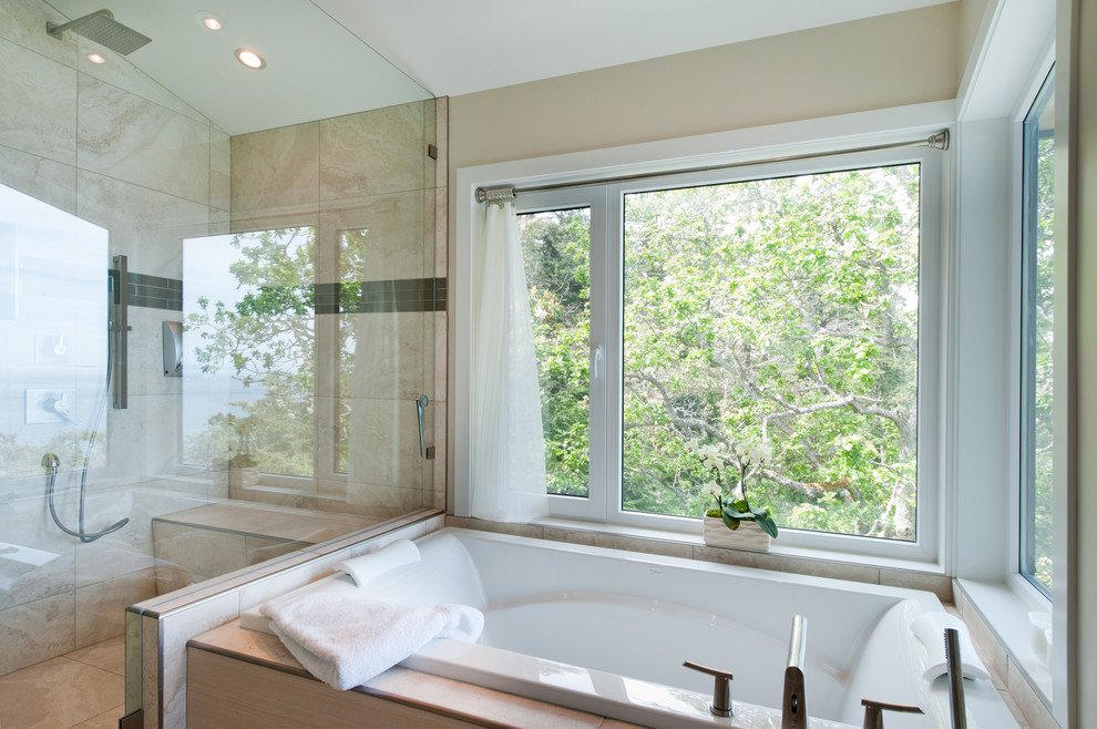 Design ideas for a contemporary bathroom in Vancouver with a drop-in tub.