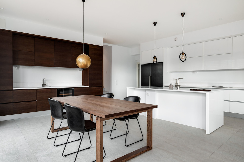Design ideas for a scandinavian eat-in kitchen in Malmo with flat-panel cabinets, white cabinets, white splashback, with island, grey floor and white benchtop.