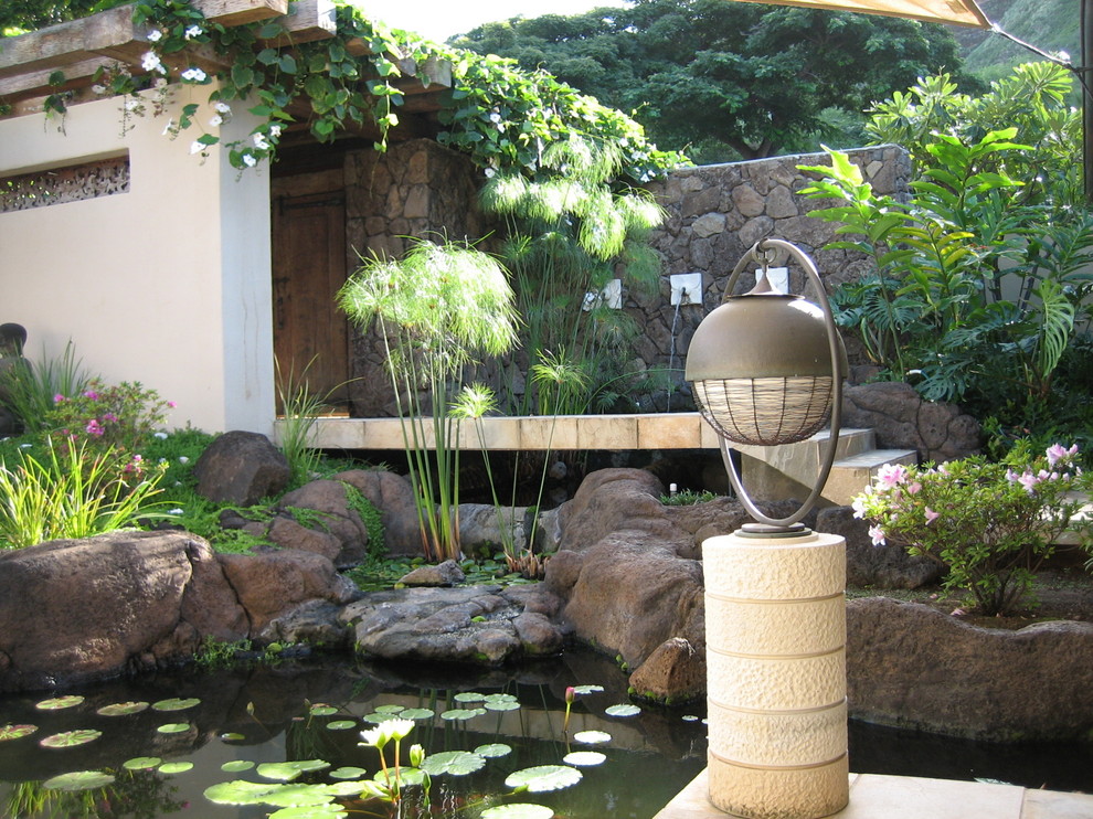 Design ideas for a tropical garden in Hawaii with a water feature.
