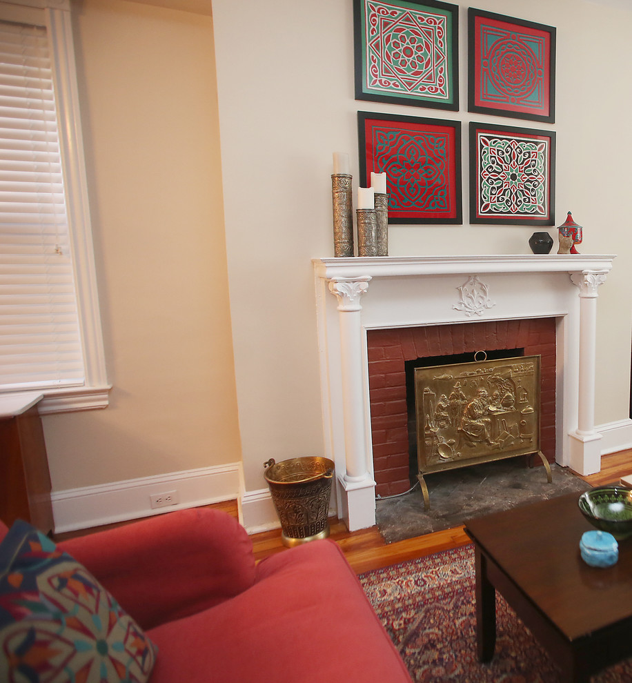 This is an example of a mid-sized eclectic open concept living room in Philadelphia with medium hardwood floors.