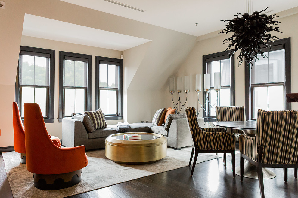 Inspiration for a contemporary open concept dark wood floor living room remodel in Boston with beige walls and no fireplace