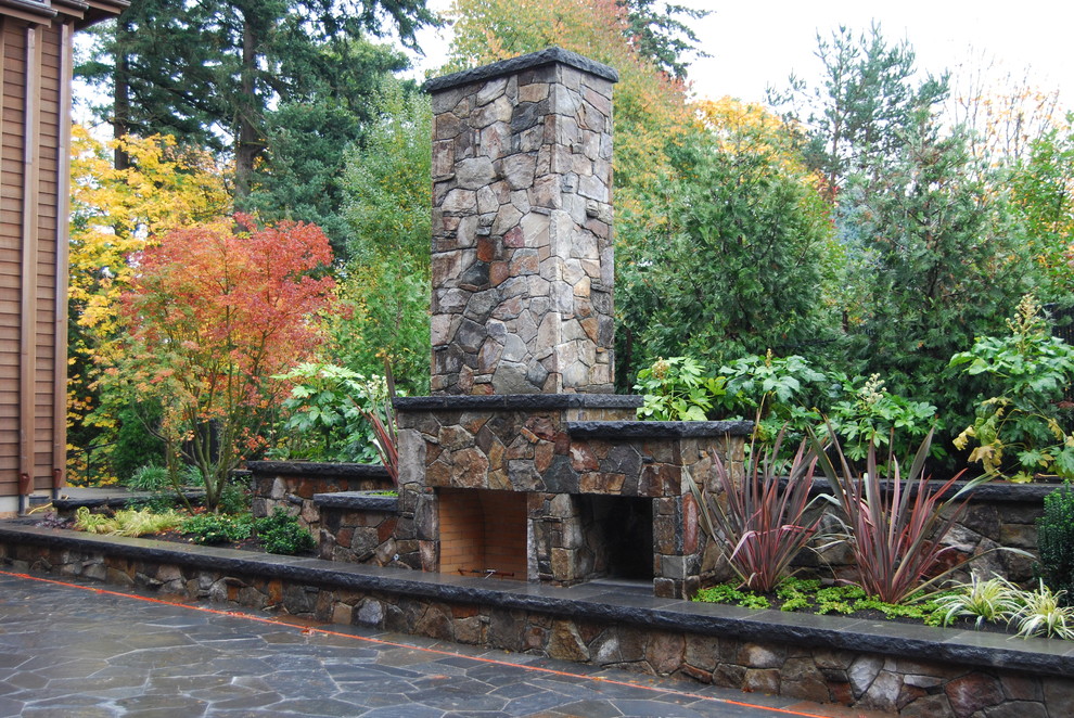Design ideas for a traditional patio in Portland with with fireplace.