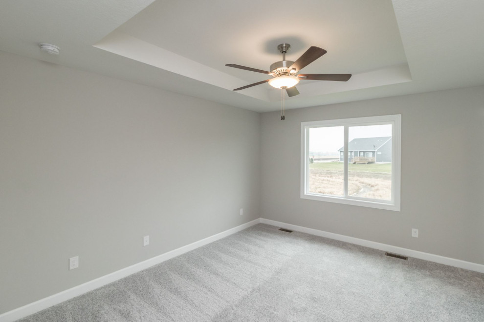 Small transitional master carpeted and gray floor bedroom photo with gray walls