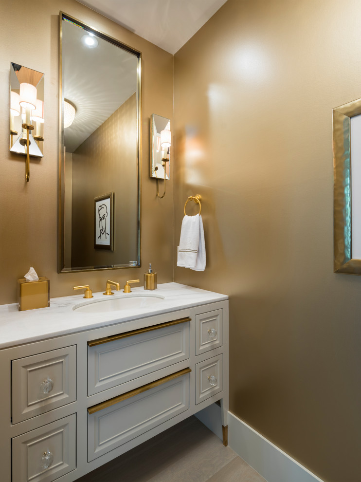 Design ideas for a contemporary powder room in Salt Lake City with furniture-like cabinets, white cabinets, brown walls, an undermount sink, grey floor and white benchtops.