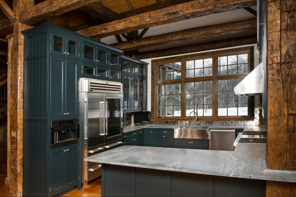 Design ideas for a large country u-shaped separate kitchen in New York with beaded inset cabinets, green cabinets, soapstone benchtops, metallic splashback, metal splashback, stainless steel appliances, light hardwood floors and a farmhouse sink.