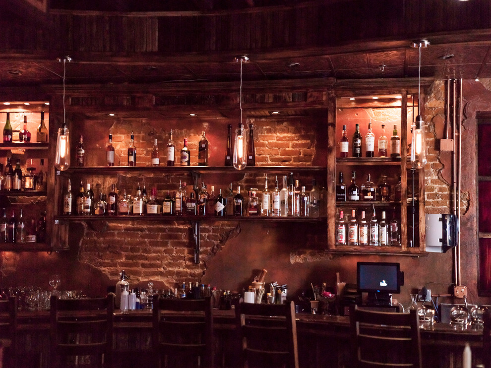 Wine cellar - rustic wine cellar idea in Austin
