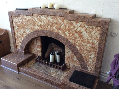 Art Deco fireplace dilemma We have bought an early 1900s house with lots of character and original features in need of full refurbishment. In the dining room there is an original light brown marble effect Art Deco fireplace which I do not particularly like but think it would be a shame to get rid of. I am looking for ideas on...