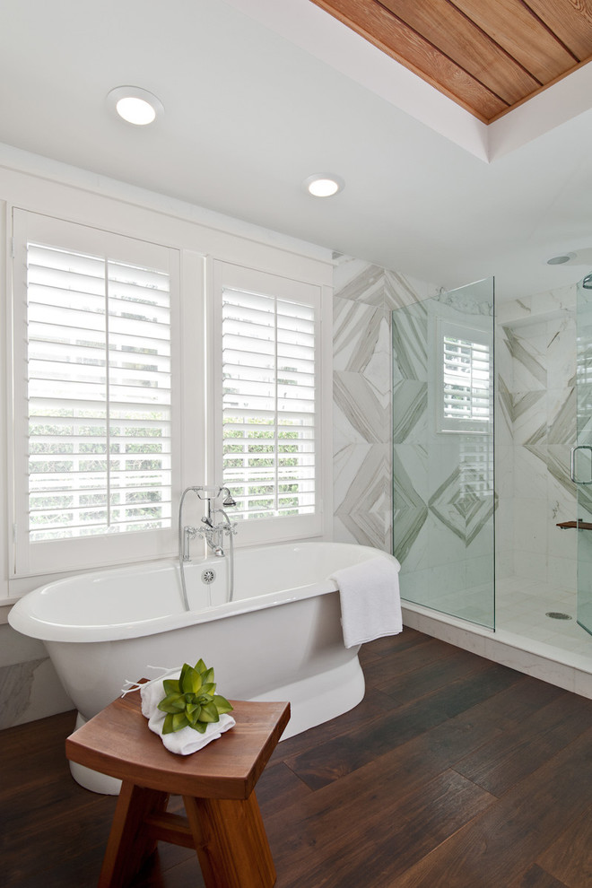 Photo of a beach style bathroom in Miami with a freestanding tub.
