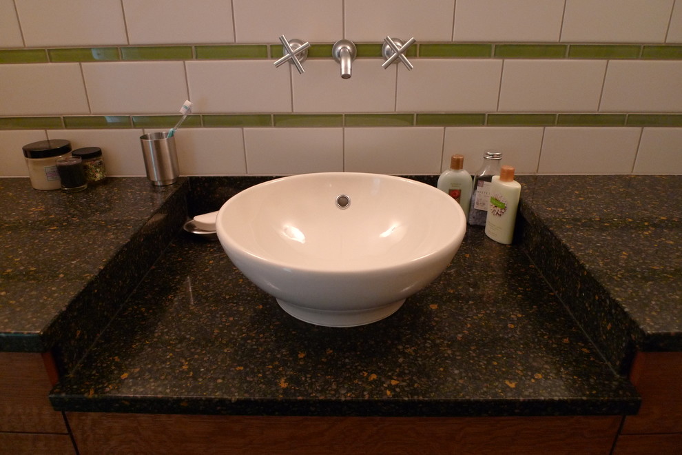 Contemporary bathroom in Seattle with subway tile and a vessel sink.
