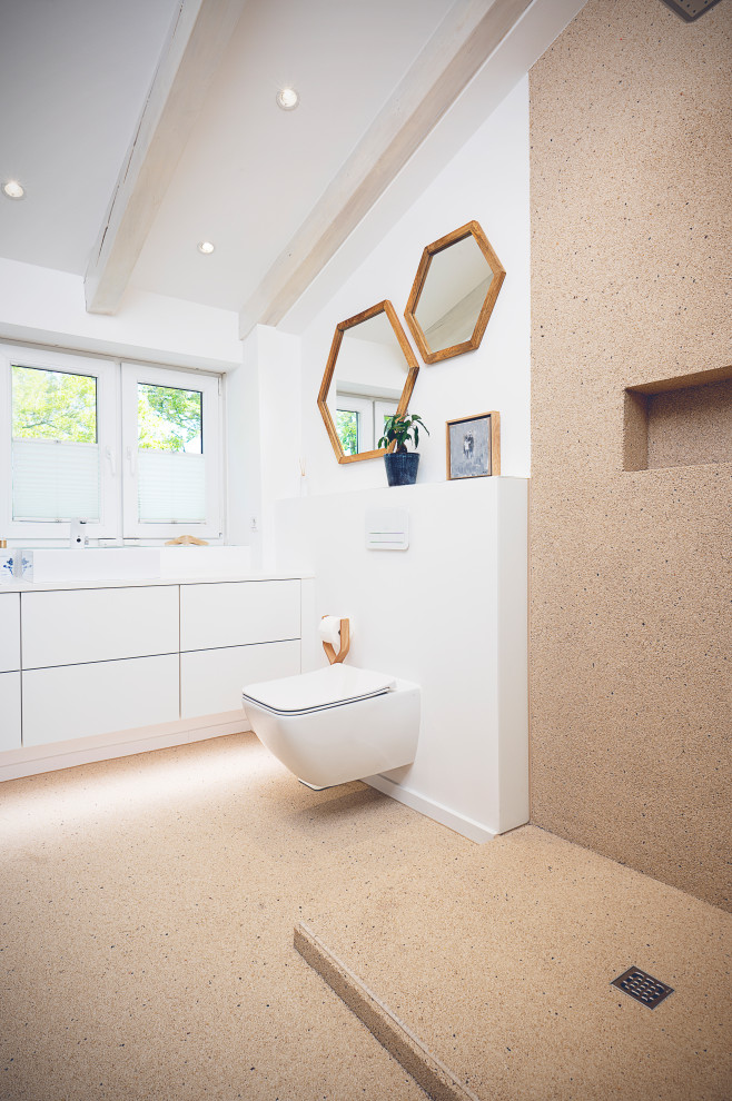 This is an example of a medium sized mediterranean shower room bathroom in Dusseldorf with a walk-in shower, beige walls, pebble tile flooring, beige floors, an open shower and a built in vanity unit.