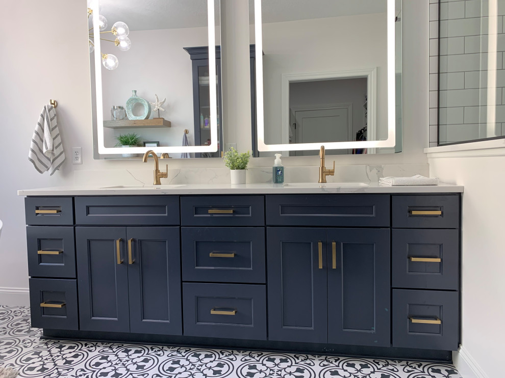 Example of a large transitional master white tile and ceramic tile vinyl floor, black floor and double-sink bathroom design in Other with recessed-panel cabinets, blue cabinets, a one-piece toilet, white walls, an undermount sink, quartz countertops, a hinged shower door, white countertops and a built-in vanity